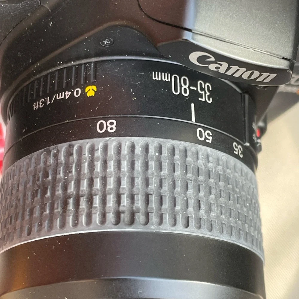 Canon Eos rebel filmed camera with 2 lenses and bag